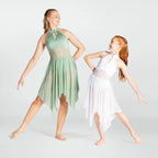 Two young girls in green and white dance dresses posing against a plain background