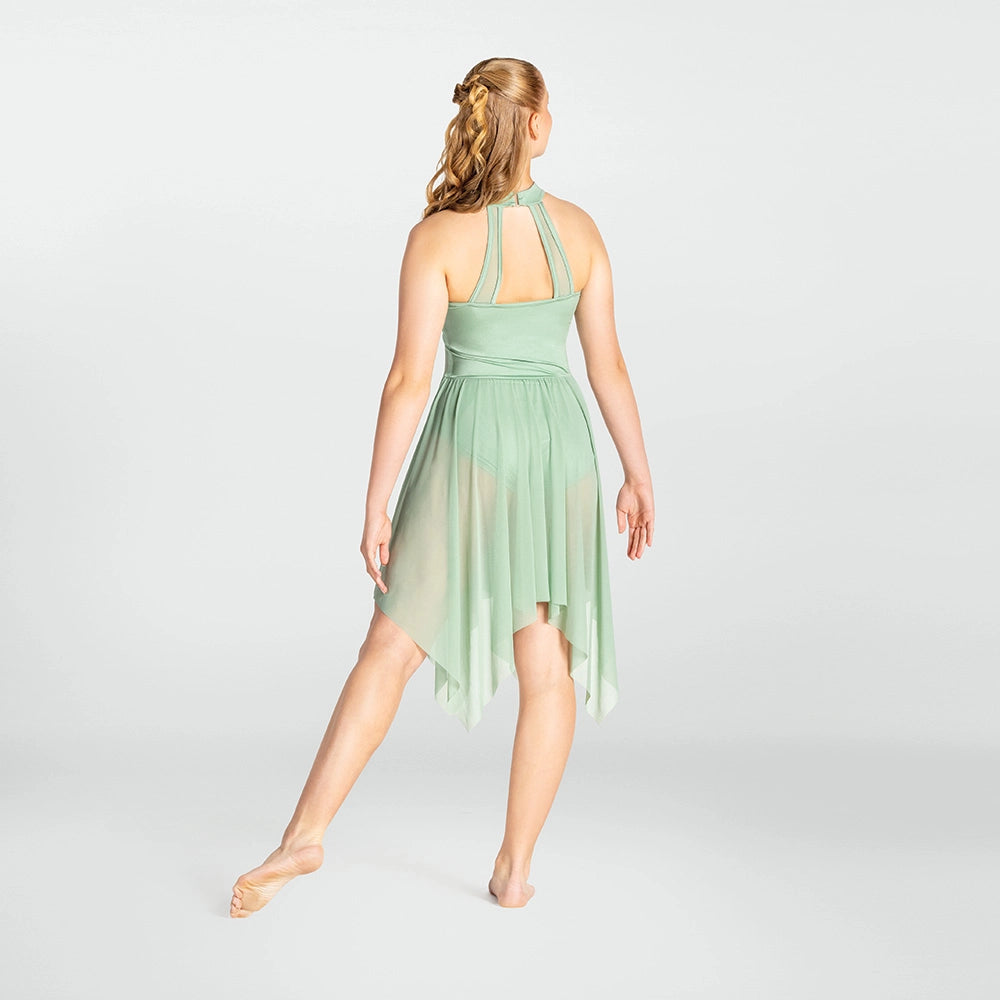 Woman wearing a light green dress on a white background