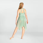 Woman wearing a light green dress on a white background