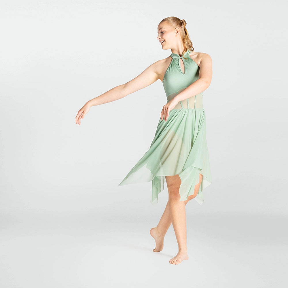 Woman wearing a light green dress on a white background