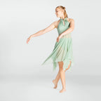 Woman wearing a light green dress on a white background