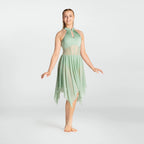 Woman wearing a light green dress on a white background