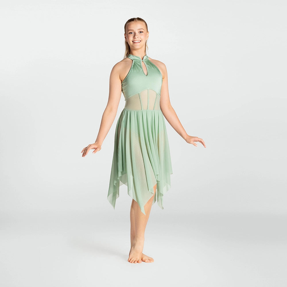 Woman wearing a light green dress on a white background