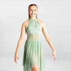 Woman wearing a light green dress with mesh panels on a white background