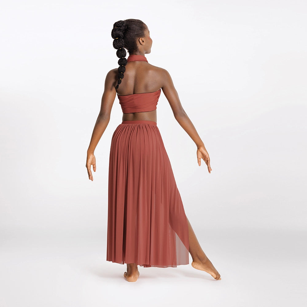 Woman wearing a rust-colored two-piece outfit on a white background