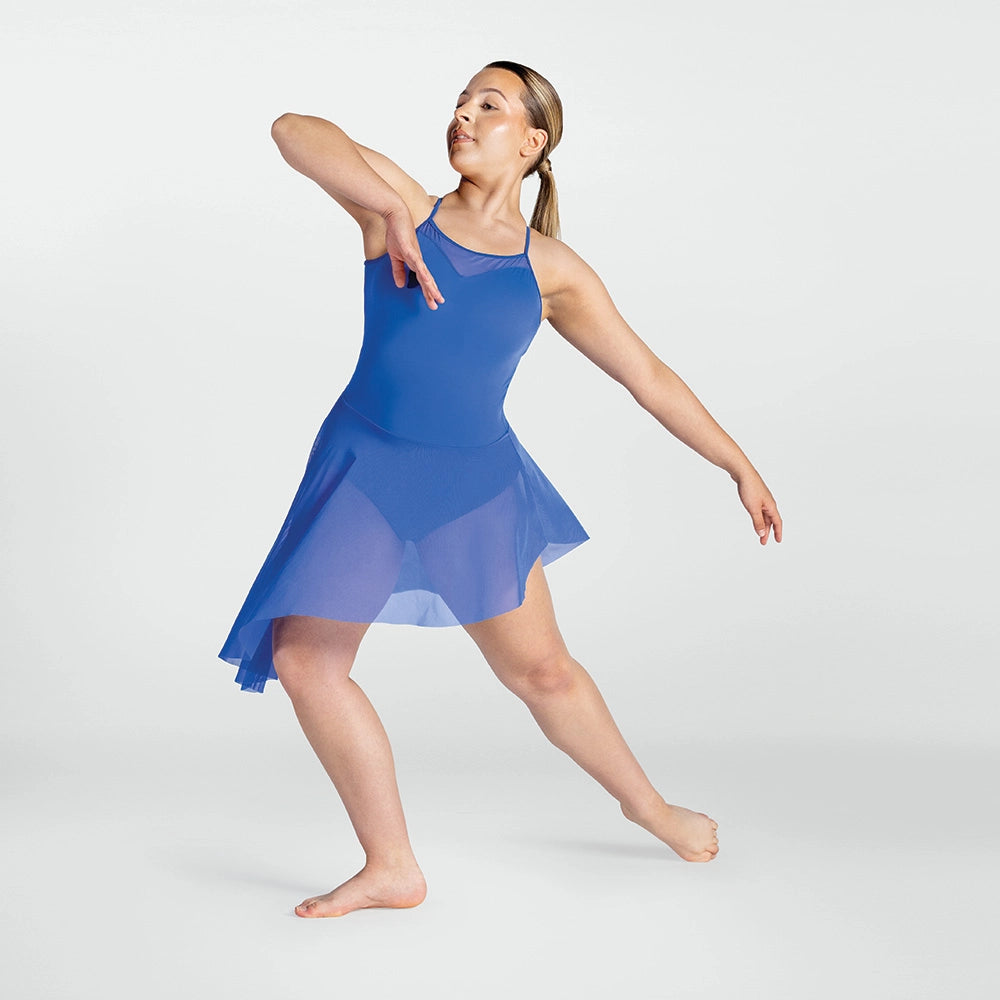 Woman in a blue dress posing on a white background