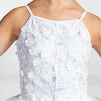 White spaghetti-strap camisole top with 3D floral appliqué and iridescent sequin embroidery, shown on a model.