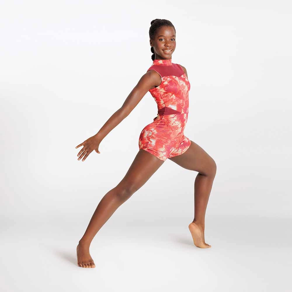 Dancer in a pink and red tie-dye leotard on a white background