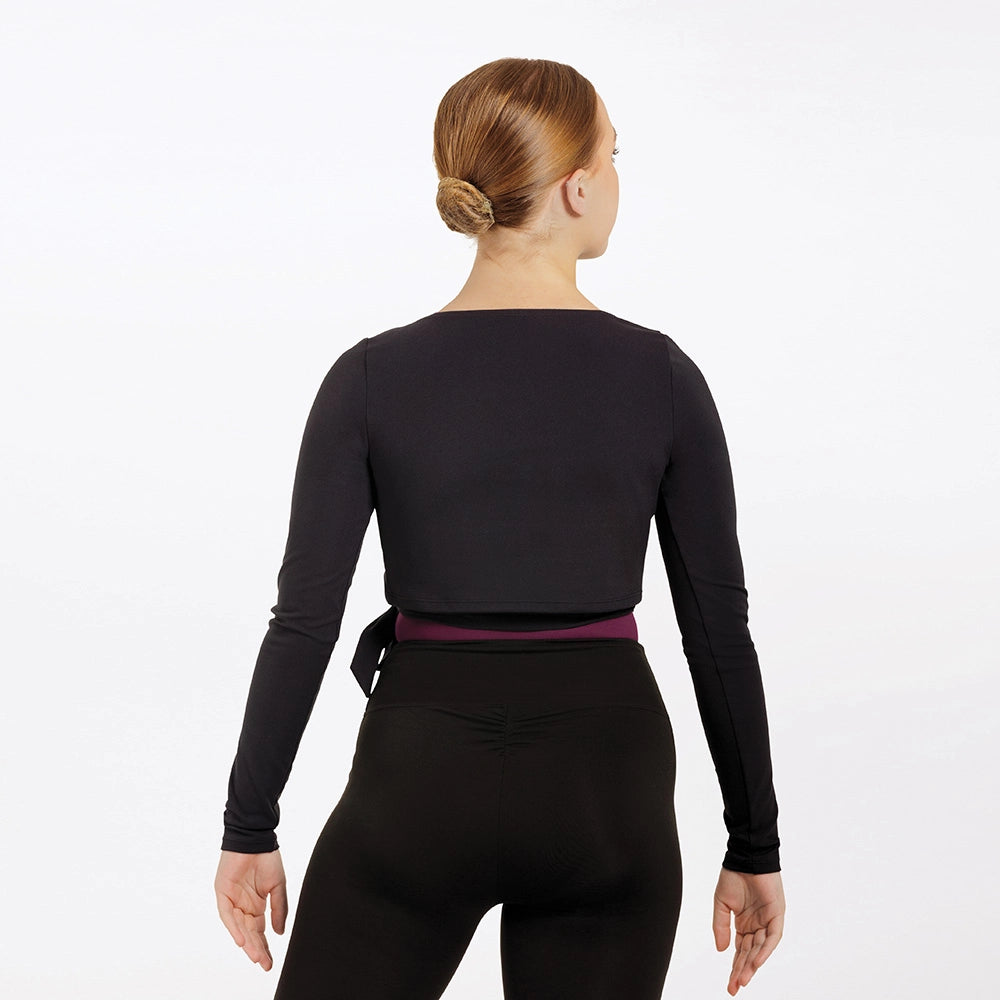 Person wearing a black long-sleeve top and black pants on a white background