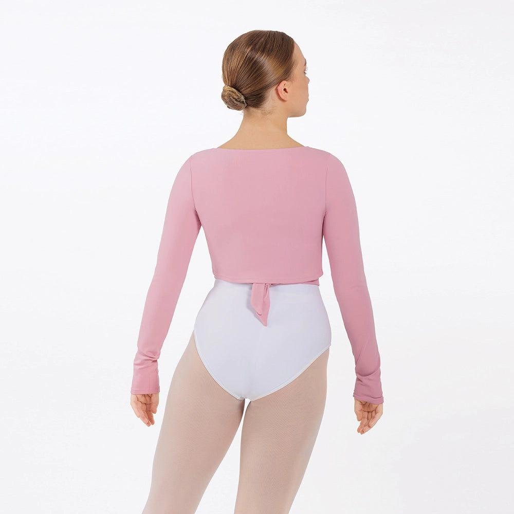 Person wearing a pink long-sleeve leotard and white bodysuit on a white background