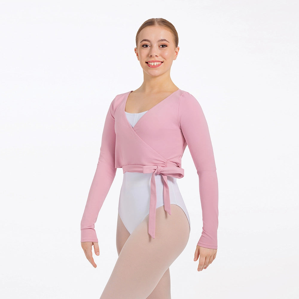 Person wearing a pink wrap top over a white leotard on a white background