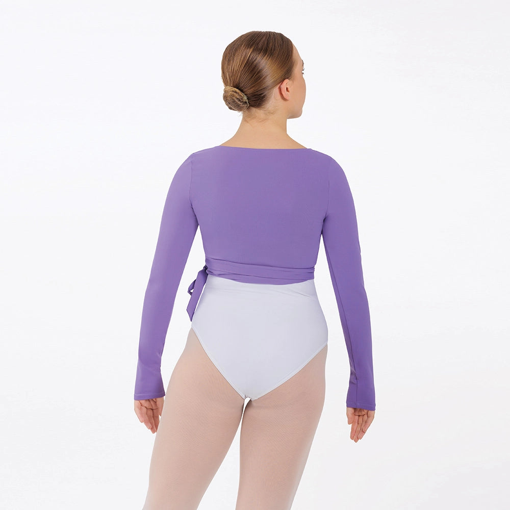Person wearing a purple long-sleeve leotard and white shorts on a white background