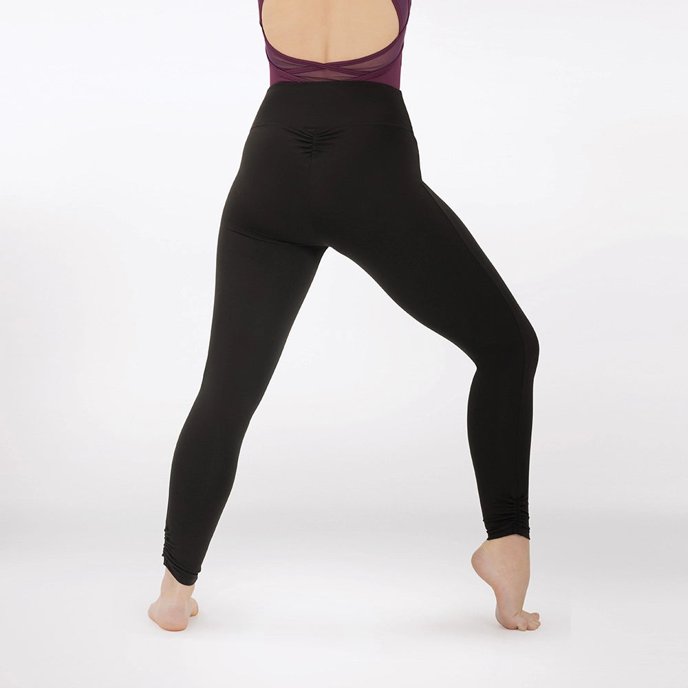 Person wearing black leggings on a white background
