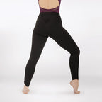 Person wearing black leggings on a white background