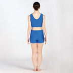 Person wearing a blue athletic outfit on a white background