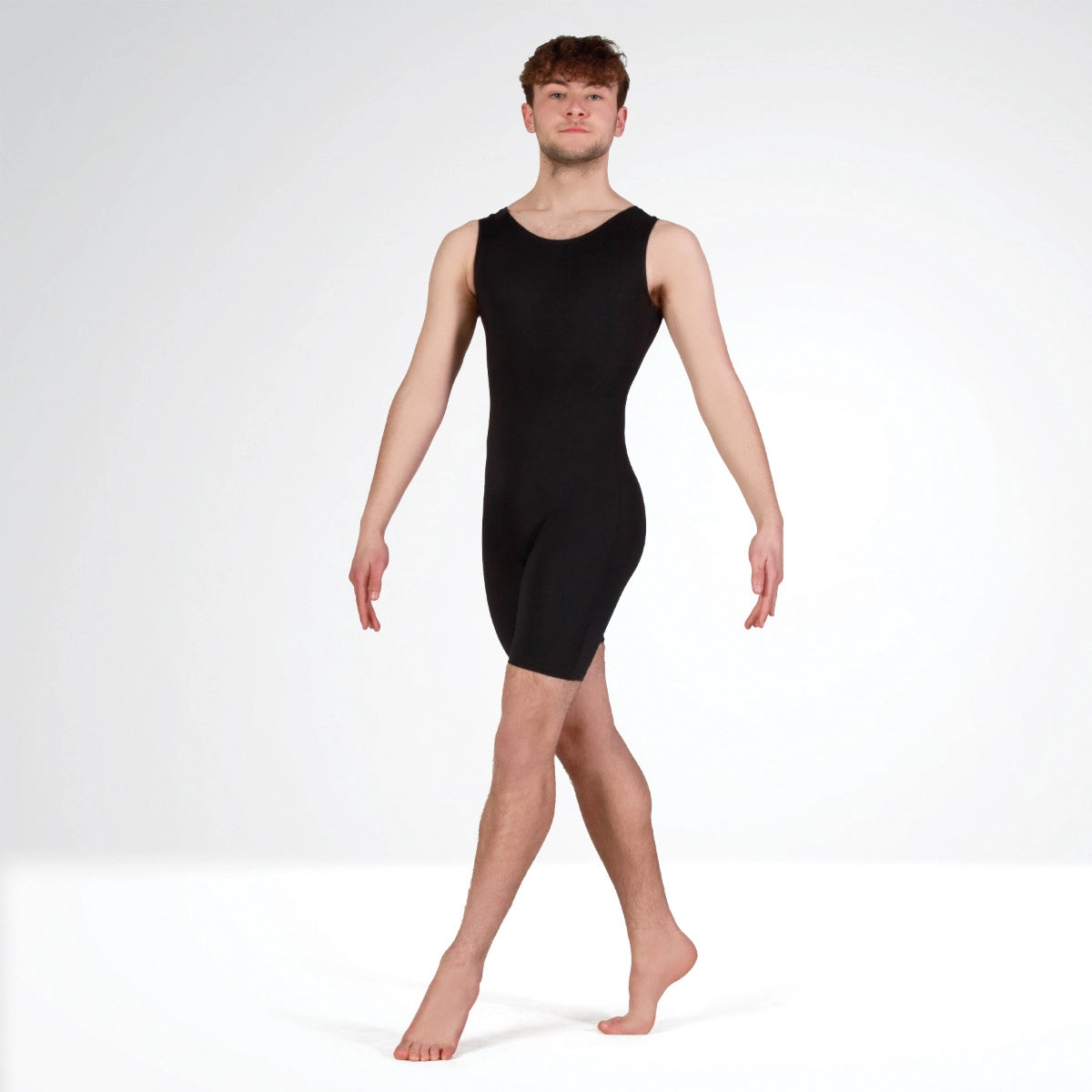 Person wearing a black bodysuit on a white background