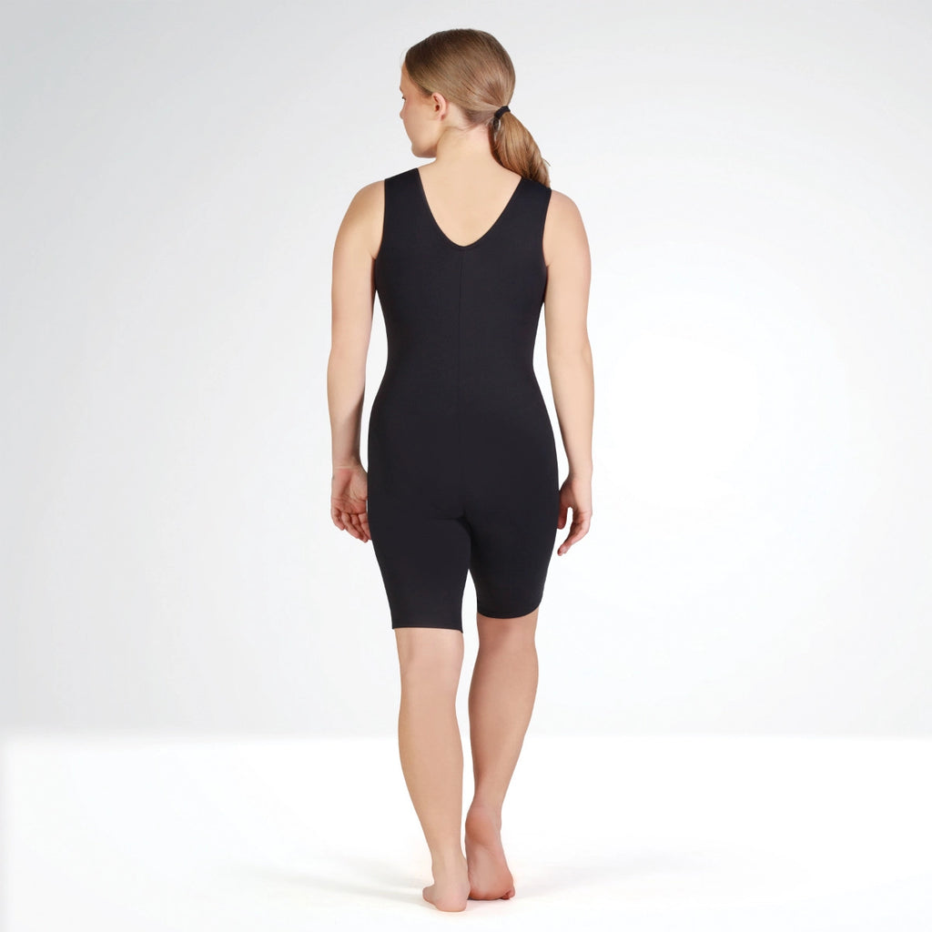 Person wearing a black bodysuit on a white background