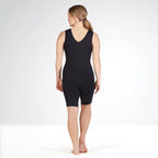 Person wearing a black bodysuit on a white background