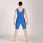 Person wearing a blue leotard on a plain background