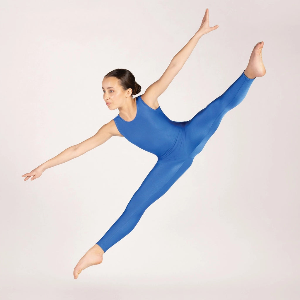 Person wearing a blue leotard performing a split on a light pink background