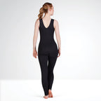 Person wearing a black bodysuit on a white background