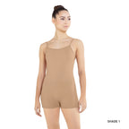 Woman wearing a beige leotard on a white background