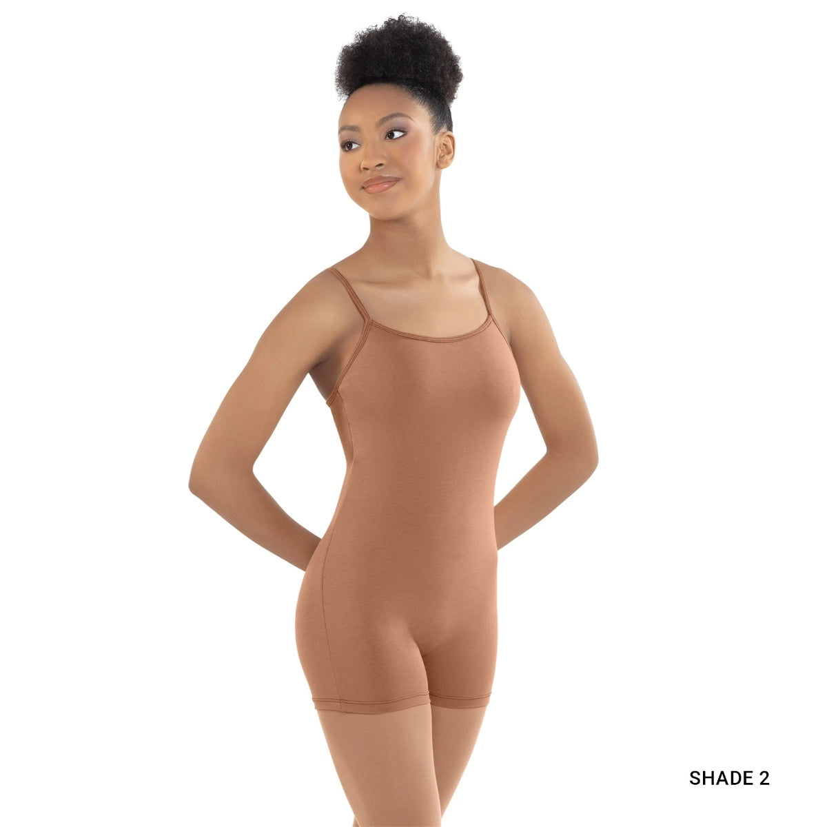 Woman wearing a brown bodysuit on a white background