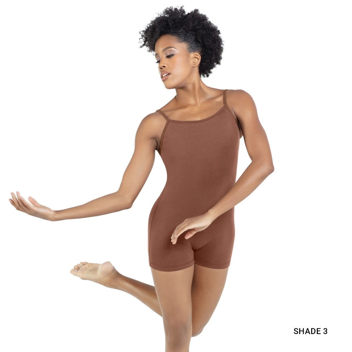 Woman wearing a brown leotard on a white background