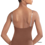 Woman wearing a brown bodysuit with thin straps on a white background