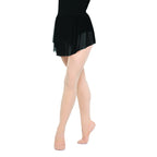 Black skirt worn over beige tights on a white background