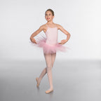 Ballerina in a pink tutu posing on a plain background