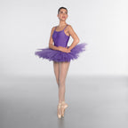 Ballerina in a purple tutu posing on a white background