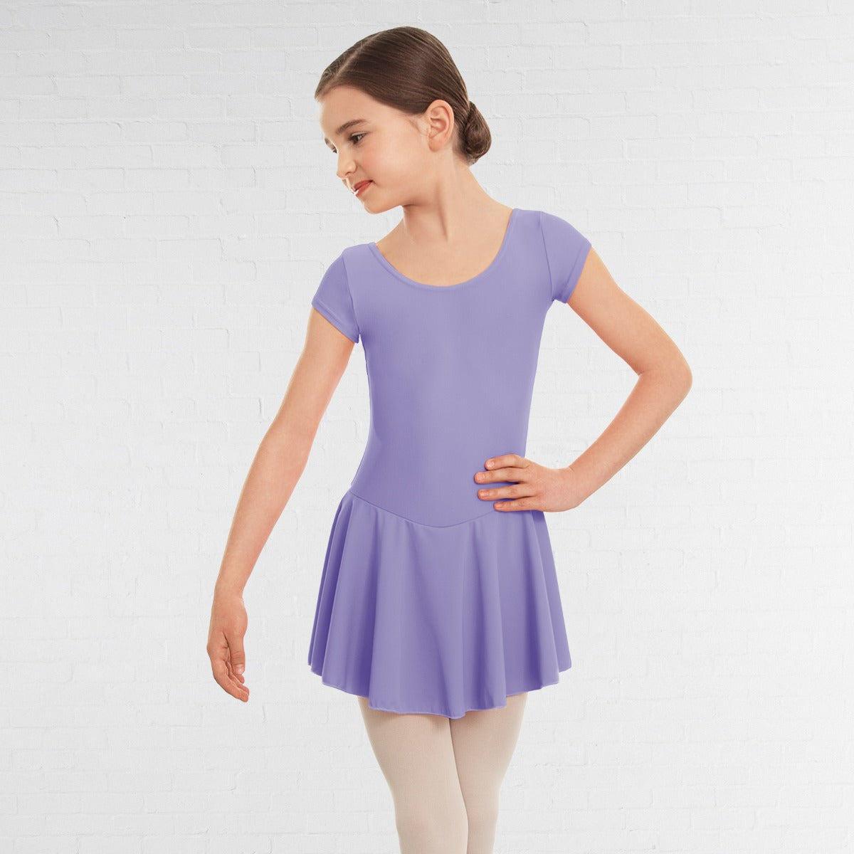 Young girl wearing a purple dress on a white background
