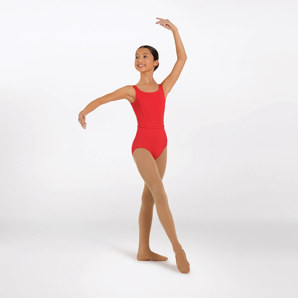 A young ballerina dancer posing in a bright red sleeveless leotard and nude tights against a clean white studio background.
