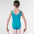 A young girl viewed from behind wearing a bright turquoise sleeveless dance leotard with a small white 'RAD DANCE' logo on the upper back, paired with light pink tights, against a white brick wall background.
