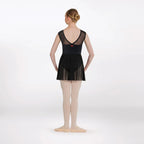 Person wearing a black ballet dress on a white background