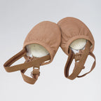 Pair of brown leather dance shoes on a light gray background