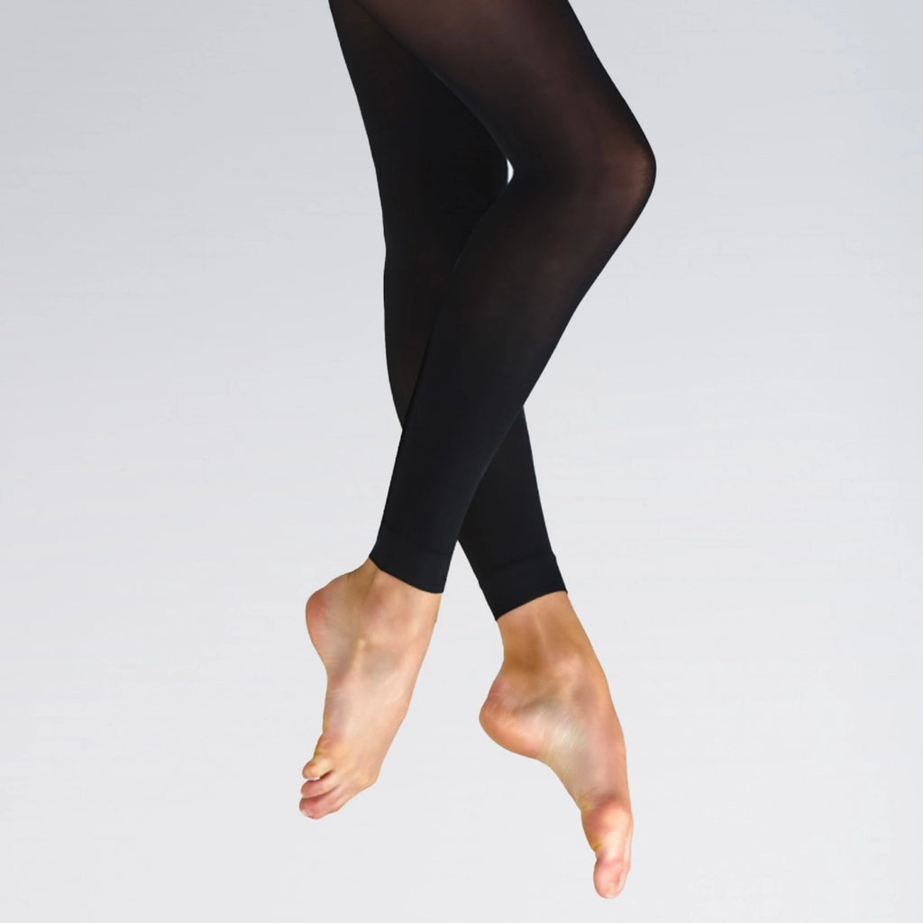 Black leggings worn by a person on a light gray background