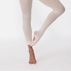 Beige tights worn by a person on a white background