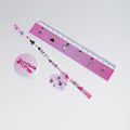 Pink stationery set with ruler, pen, and eraser featuring ballerina designs on a white background.